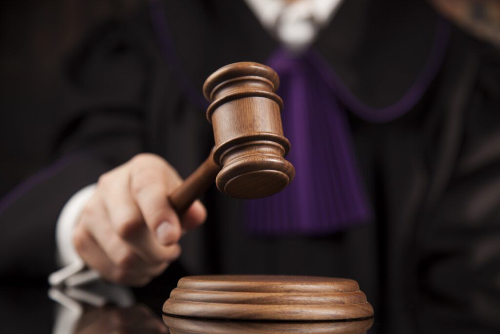Judge slamming gavel in car accident injury trial