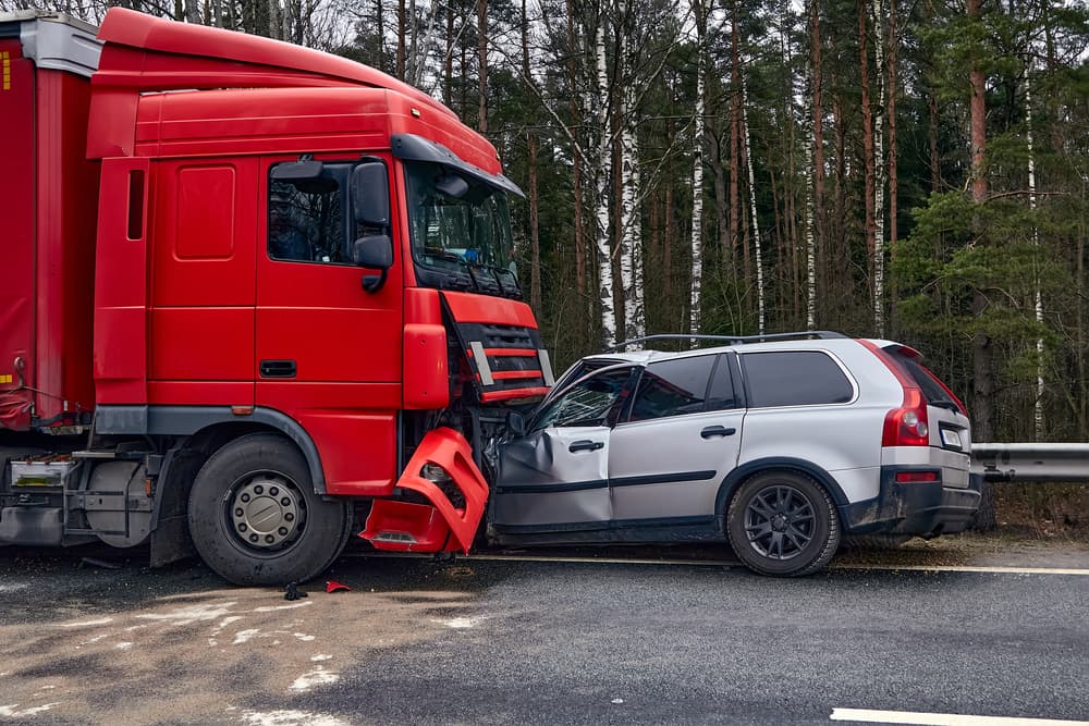 Collision between a truck and car