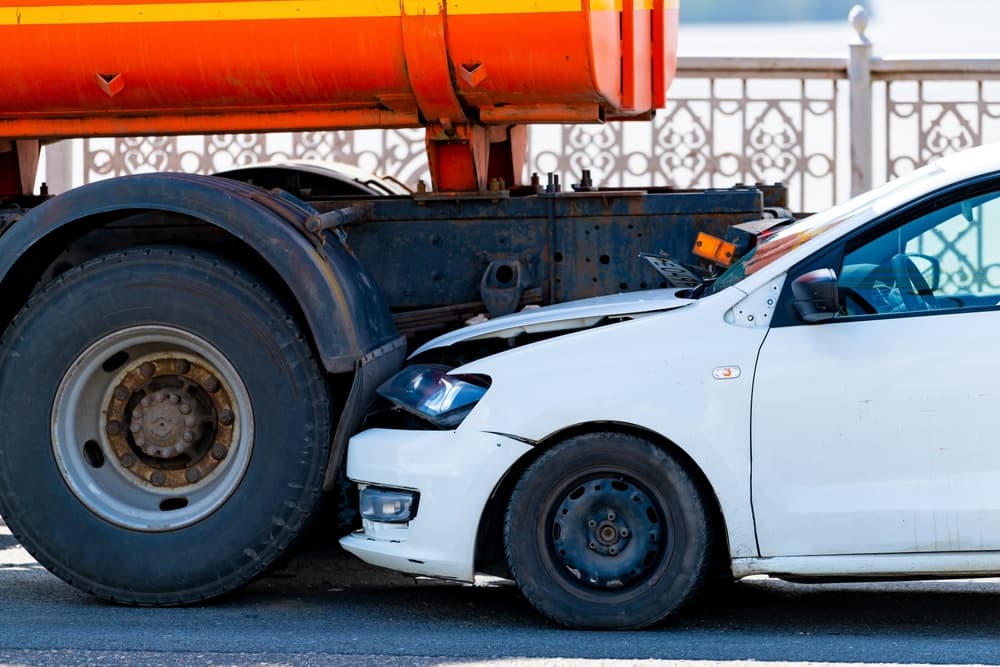 The car was involved in a road accident, crashing into the rear end of a truck.