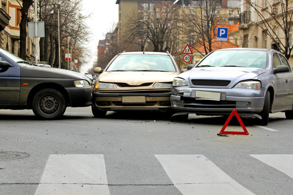 Three car crash traffic accident at street